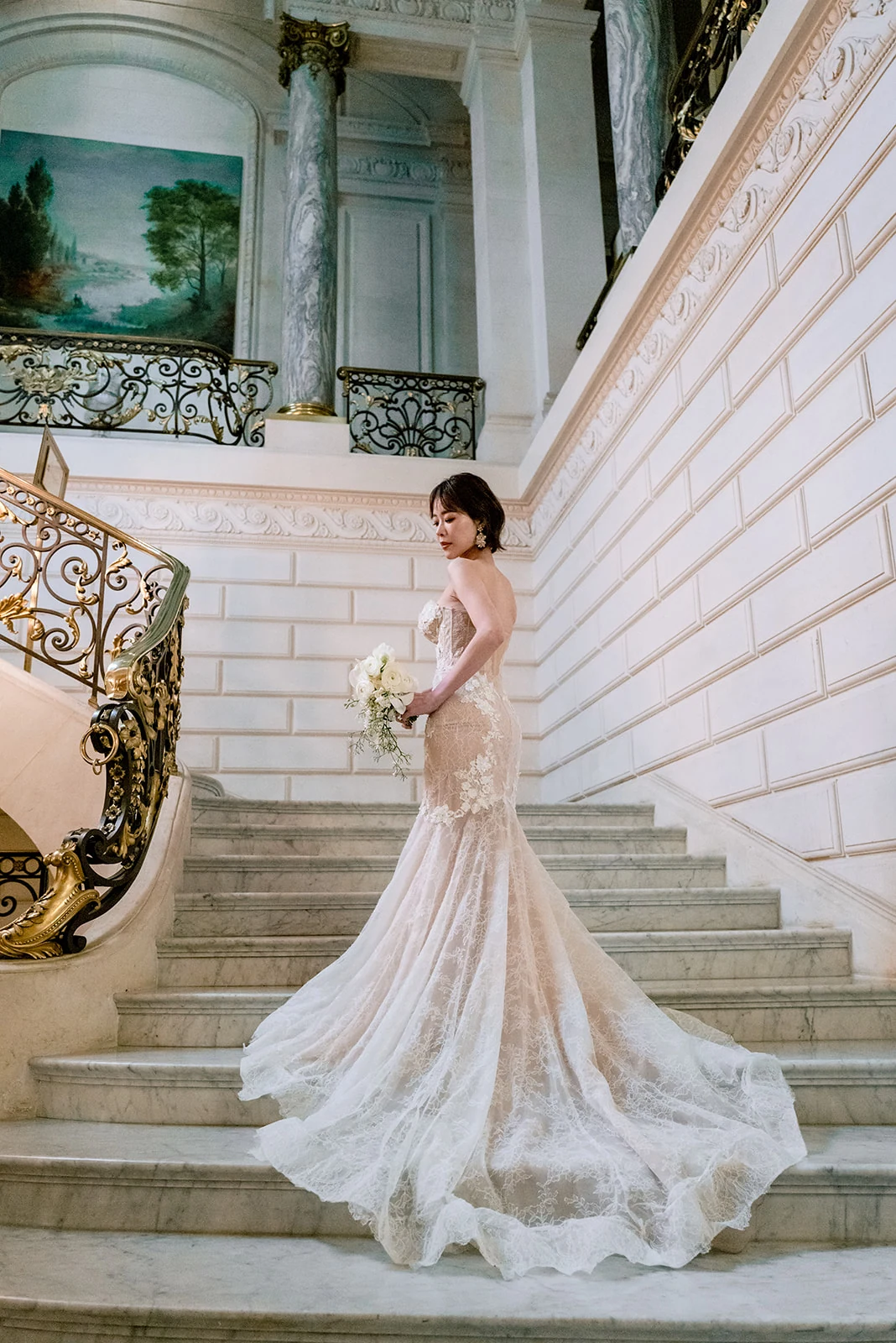 Bride in a couture gown on the Shangri-La Paris grand staircase