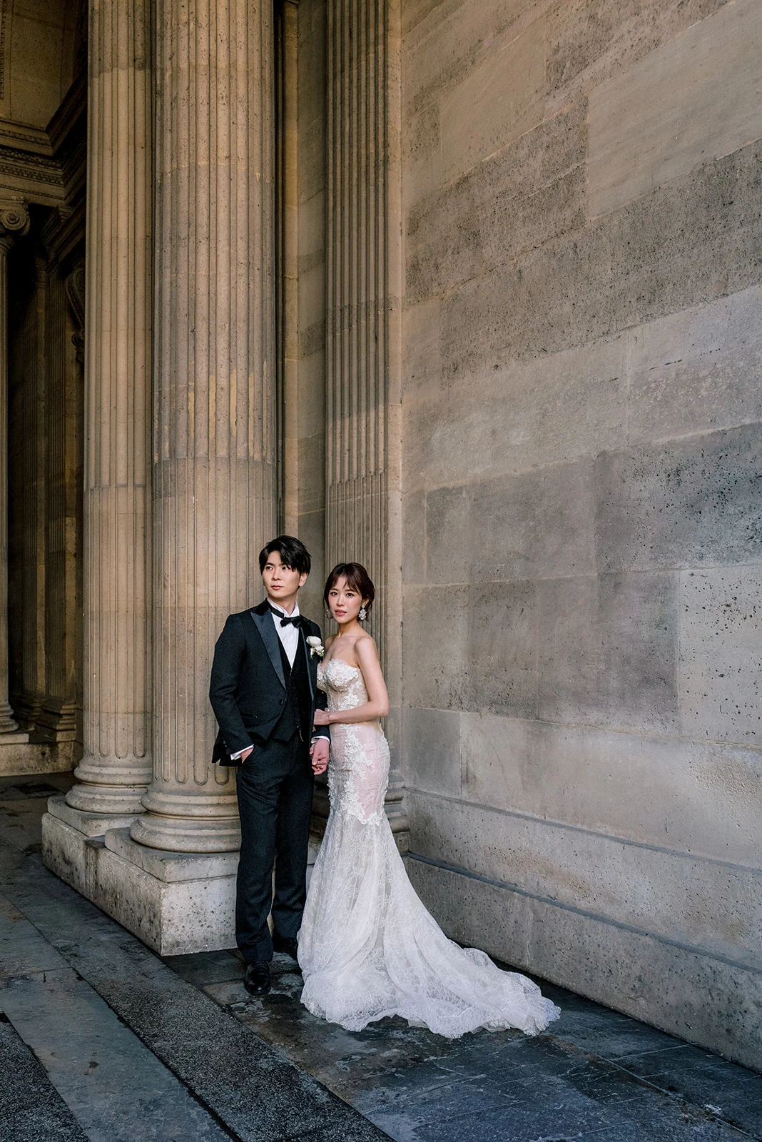 Flash-lit wedding portrait of an Asian couple in Paris