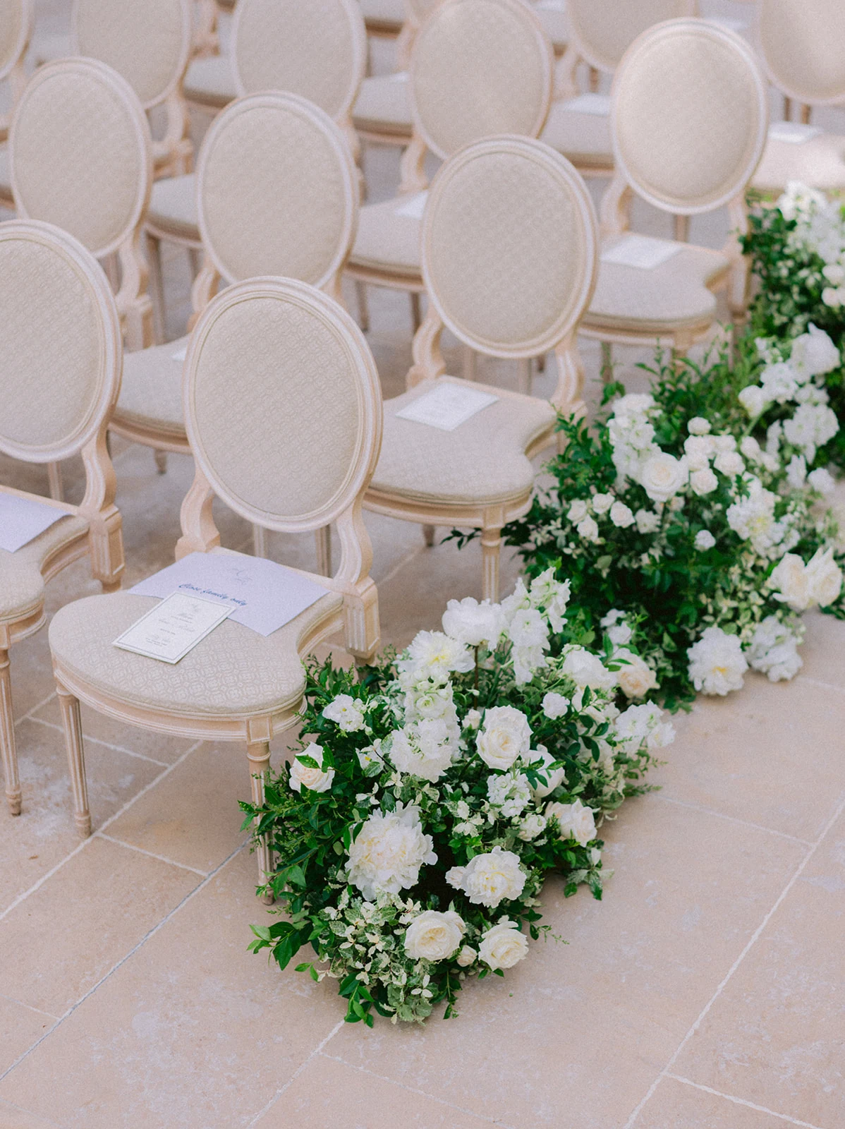 Luxury white flower wedding aisle in a private Paris garden