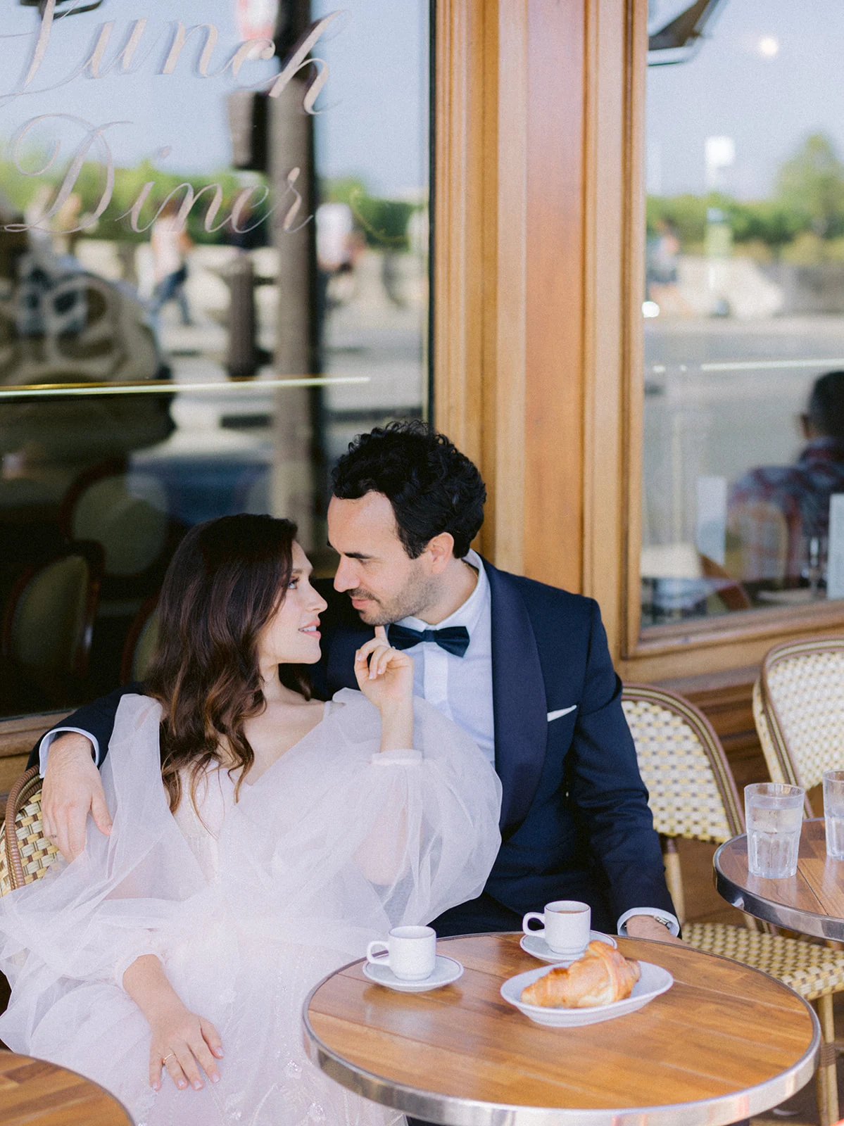 Couple sharing a quiet café moment during their Paris elopement