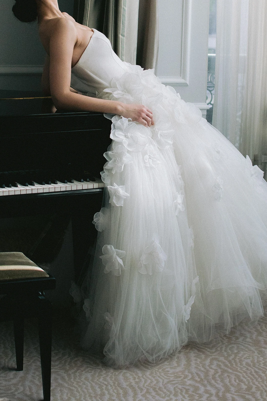 Editorial bridal fashion portrait by piano at Plaza Athénée