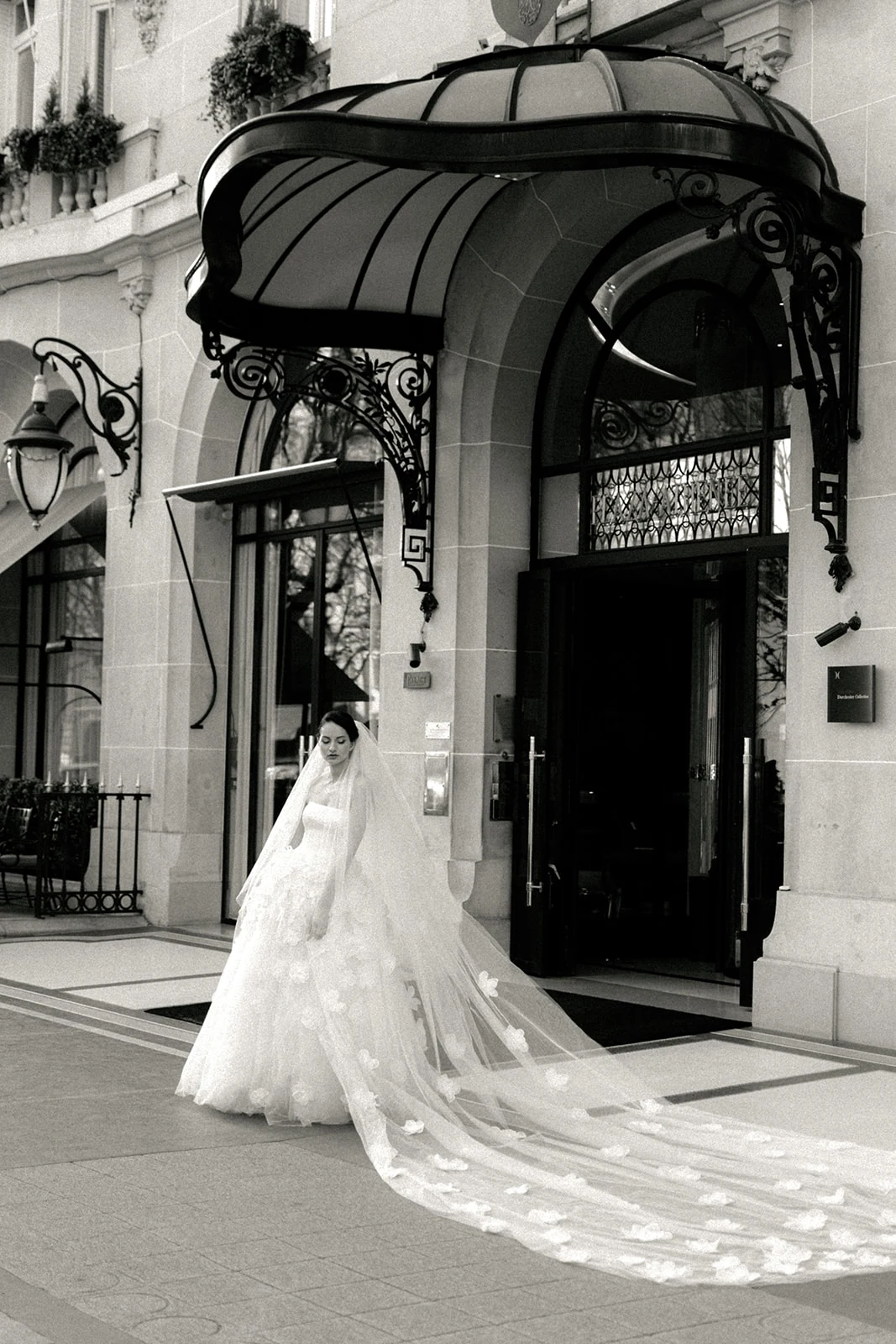 Bride outside Hôtel Plaza Athénée entrance in Paris