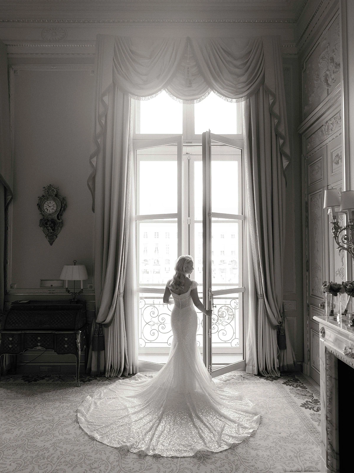 Editorial bridal portrait beside a tall window at The Ritz Paris