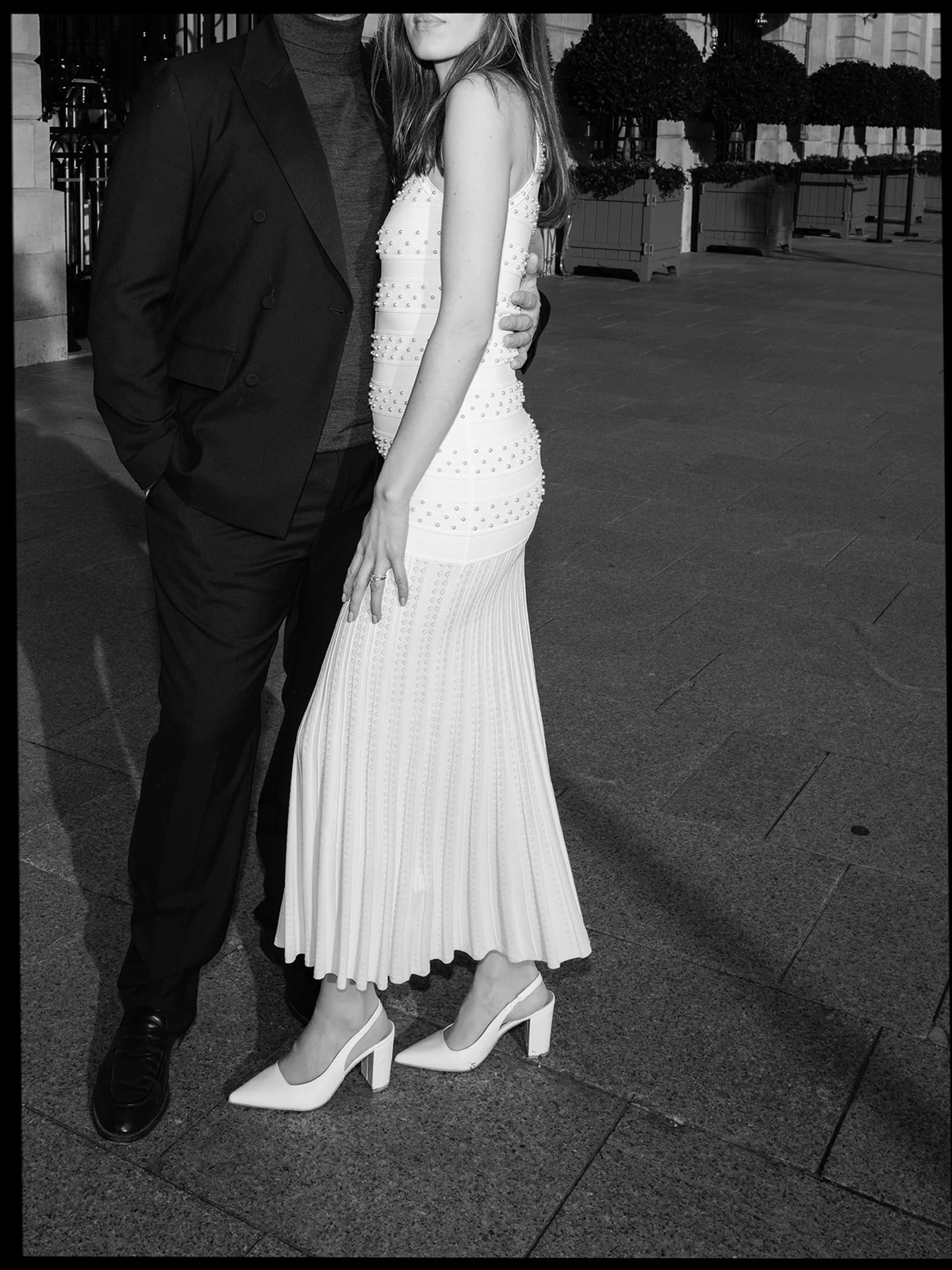 Black-and-white fashion couple portrait photographed outside the Ritz Paris