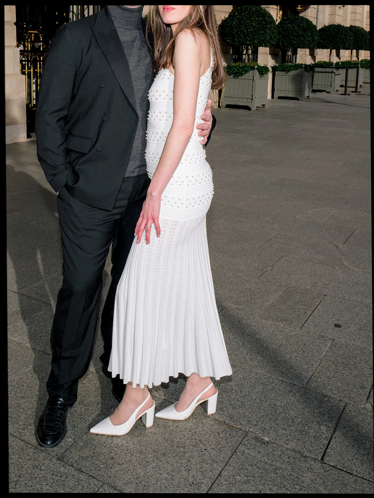 Fashion couple portrait photographed with direct flash outside the Ritz Paris
