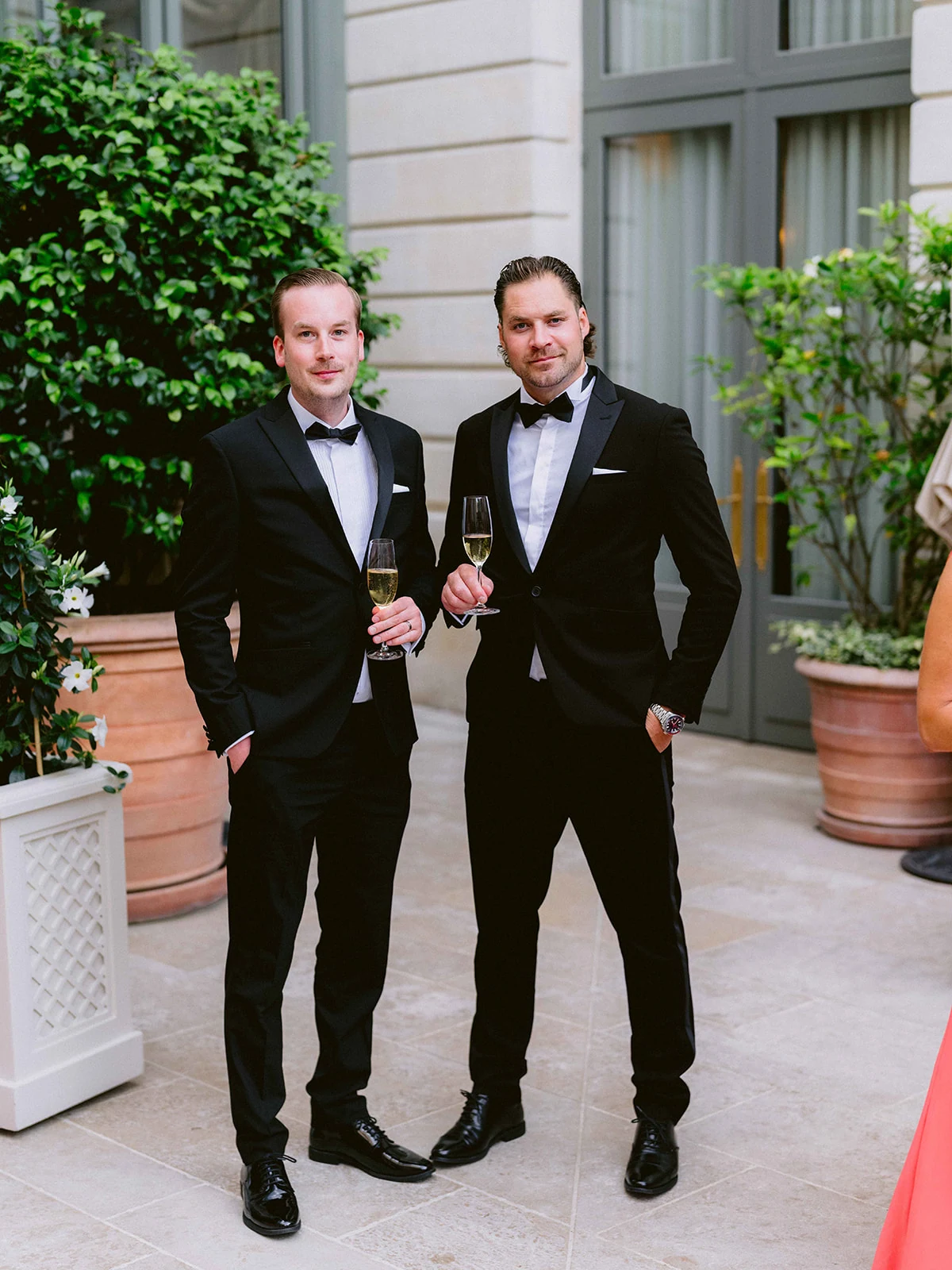 Wedding guests enjoying cocktails in the courtyard of The Ritz Paris