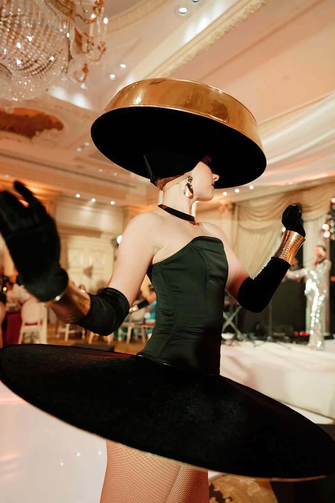 Black-costumed entertainer performing during a wedding reception at Shangri-La Paris