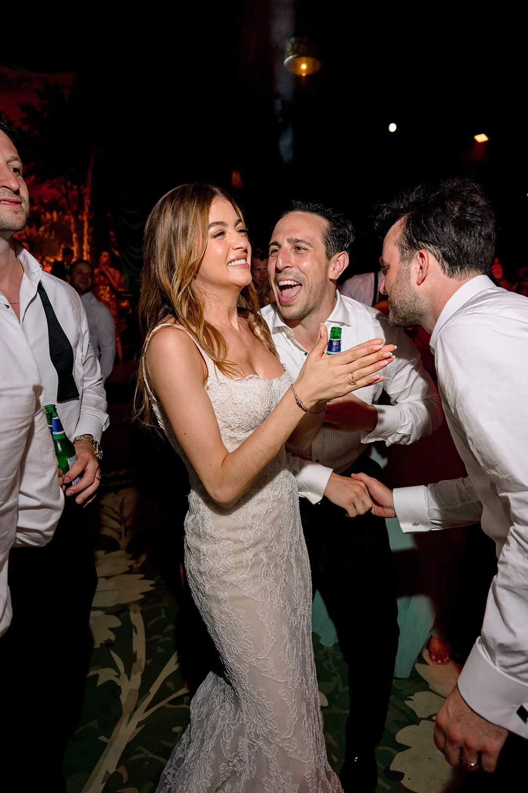 Bride laughing with friends on the Villa Baulieu wedding dance floor