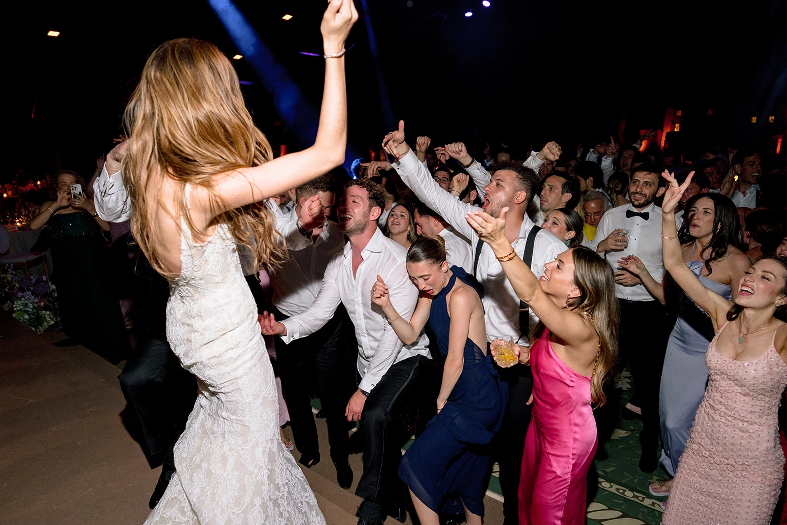 Bride leading the celebration on the packed dance floor at Villa Baulieu
