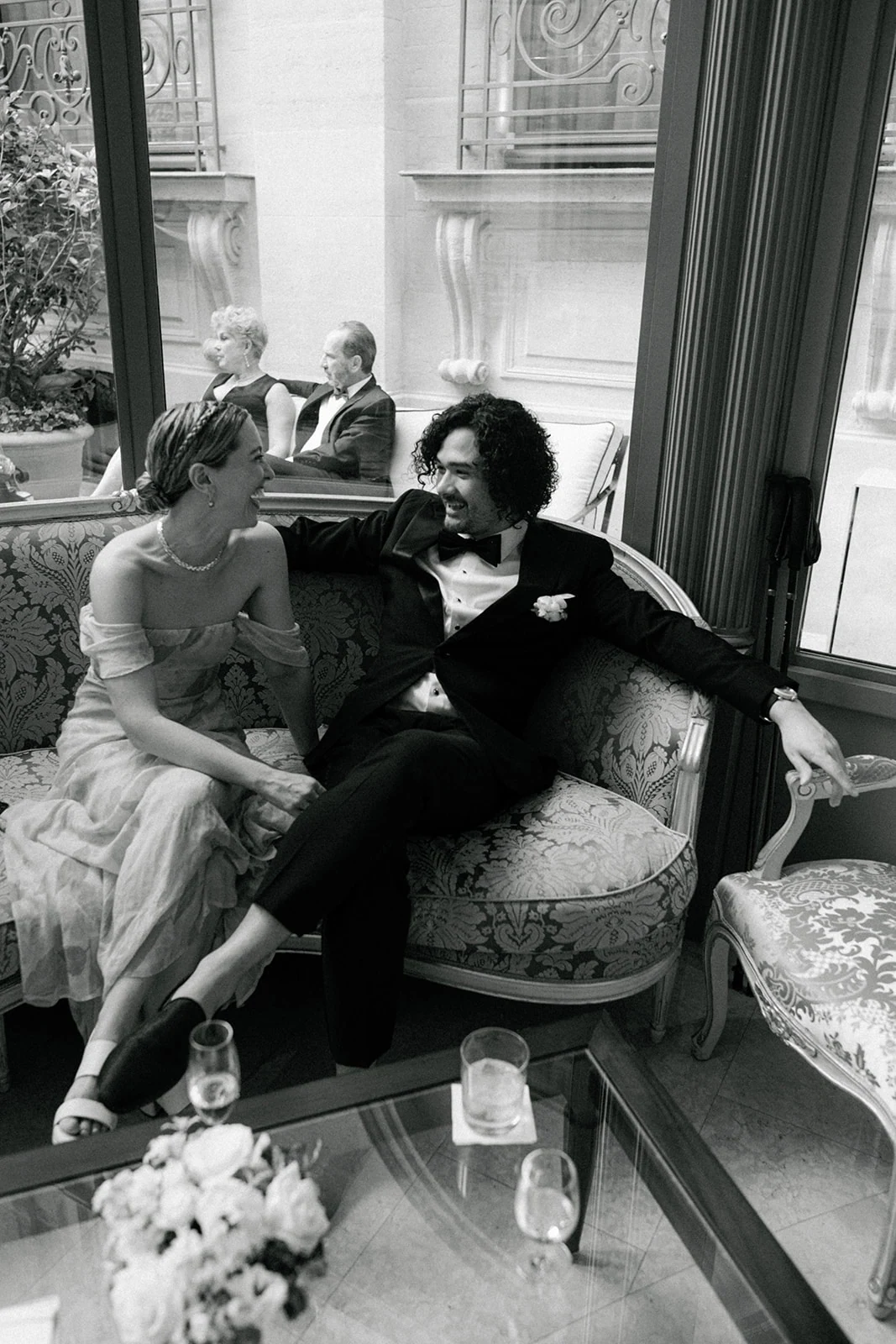 Wedding guests sharing a candid moment during the Ritz Paris reception
