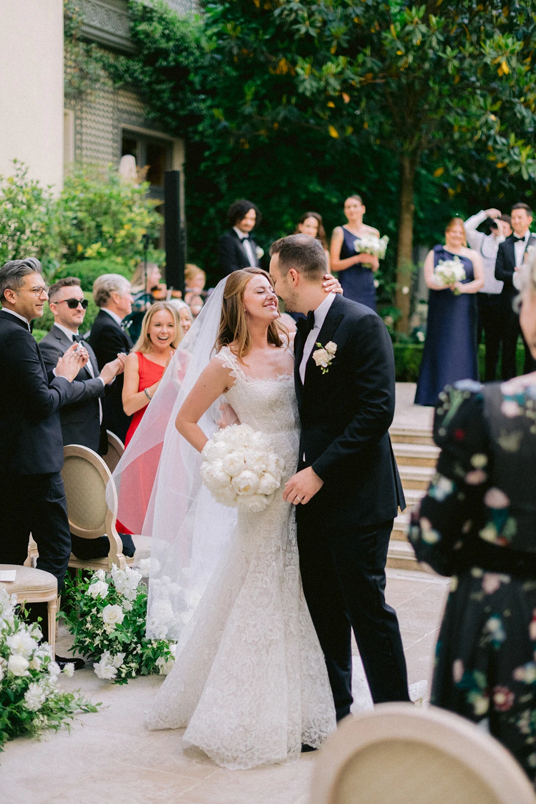 Newlyweds kissing after an intimate ceremony in Paris