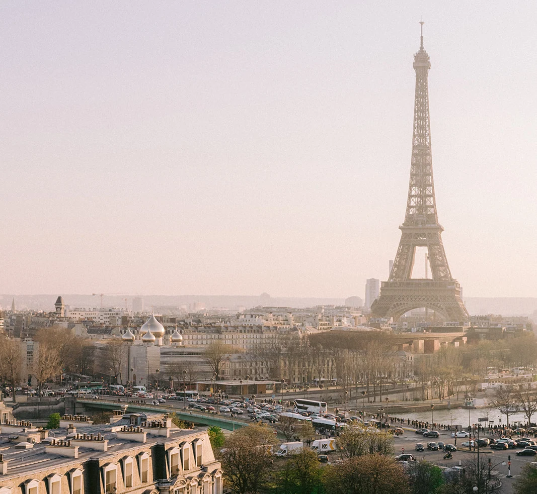 Bride and groom on the rooftop of Hôtel Plaza Athénée Paris with the Eiffel Tower