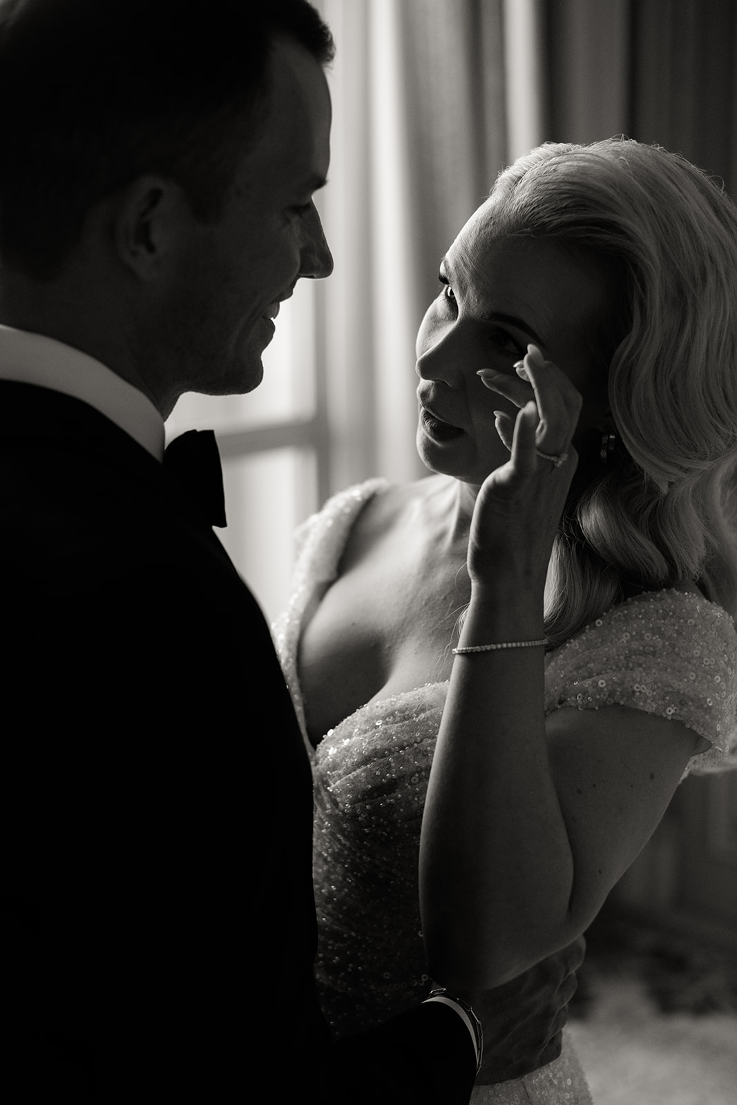 Bride and groom sharing an emotional first look inside The Ritz Paris