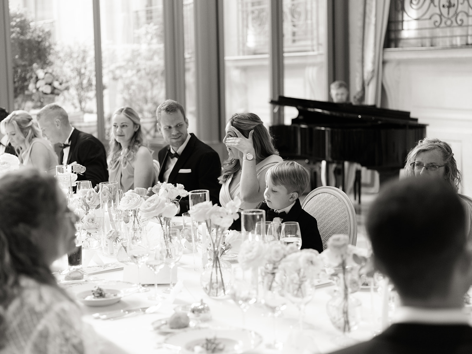 Wedding guests listening to speeches during dinner at The Ritz Paris