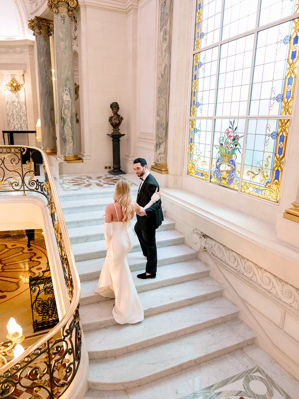Bridesmaid holding a white bouquet inside Shangri-La Paris